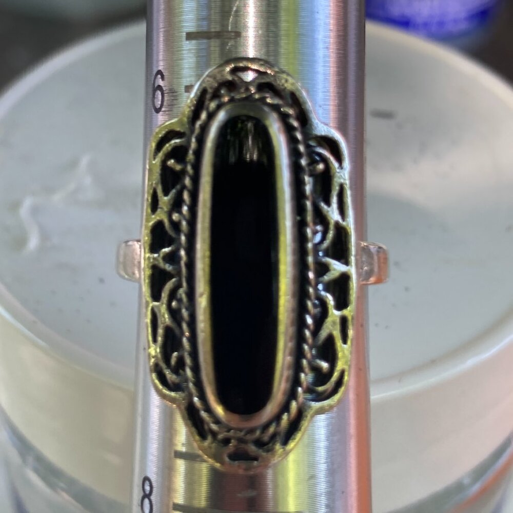 Long onyx gem in filigreed sterling silver bezel setting ring